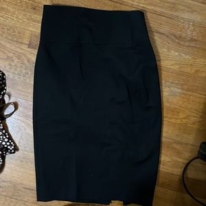Black knee length express skirt, size two.
